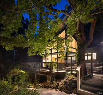 a backyard of a house with yard fire pit and outdoor seating