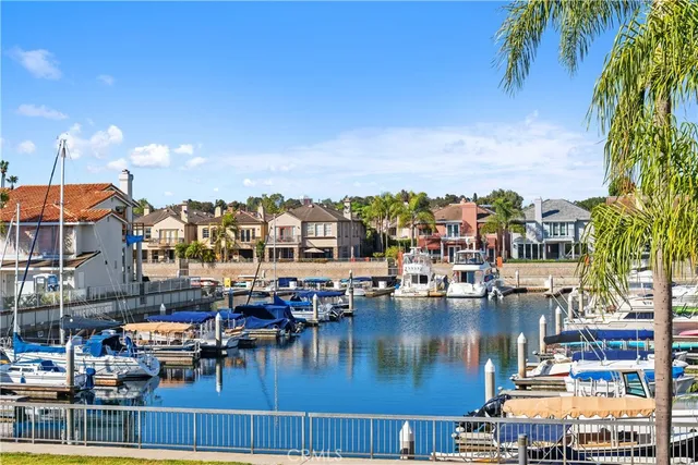 a view of water with boats and trees in the background