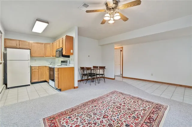 a view of kitchen with cabinets and stainless steel appliances