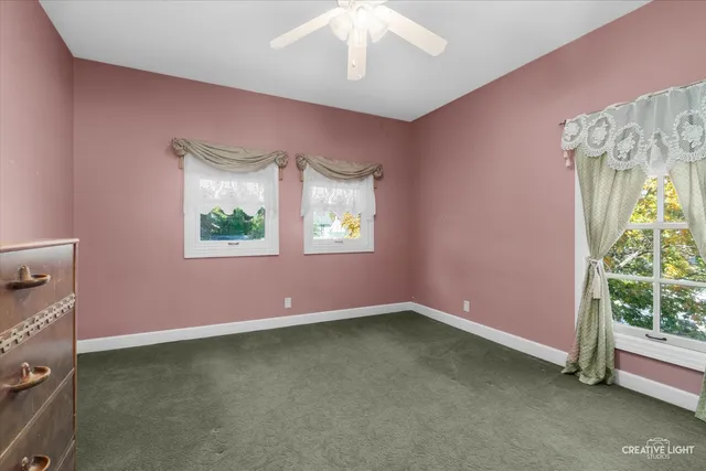 a bathroom with a toilet sink and shower