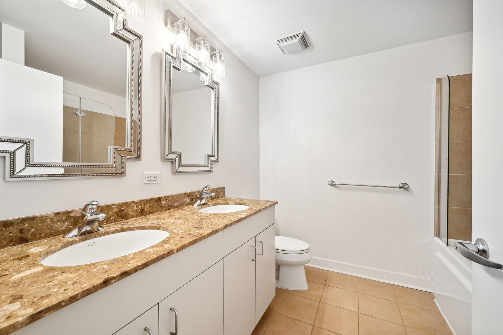 4311 North Sheridan Road, Unit 303 Chicago, IL 60613 - Photo 11 of 17 a bathroom with a granite countertop sink toilet and shower