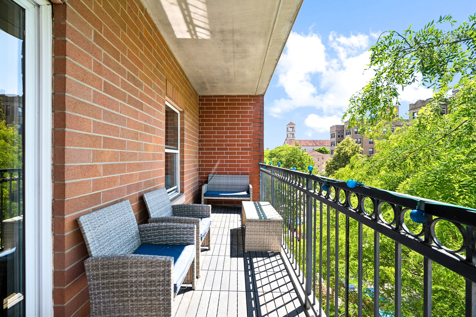 4311 North Sheridan Road, Unit 303 Chicago, IL 60613 - Photo 14 of 17 a view of balcony with wooden floor and outdoor seating