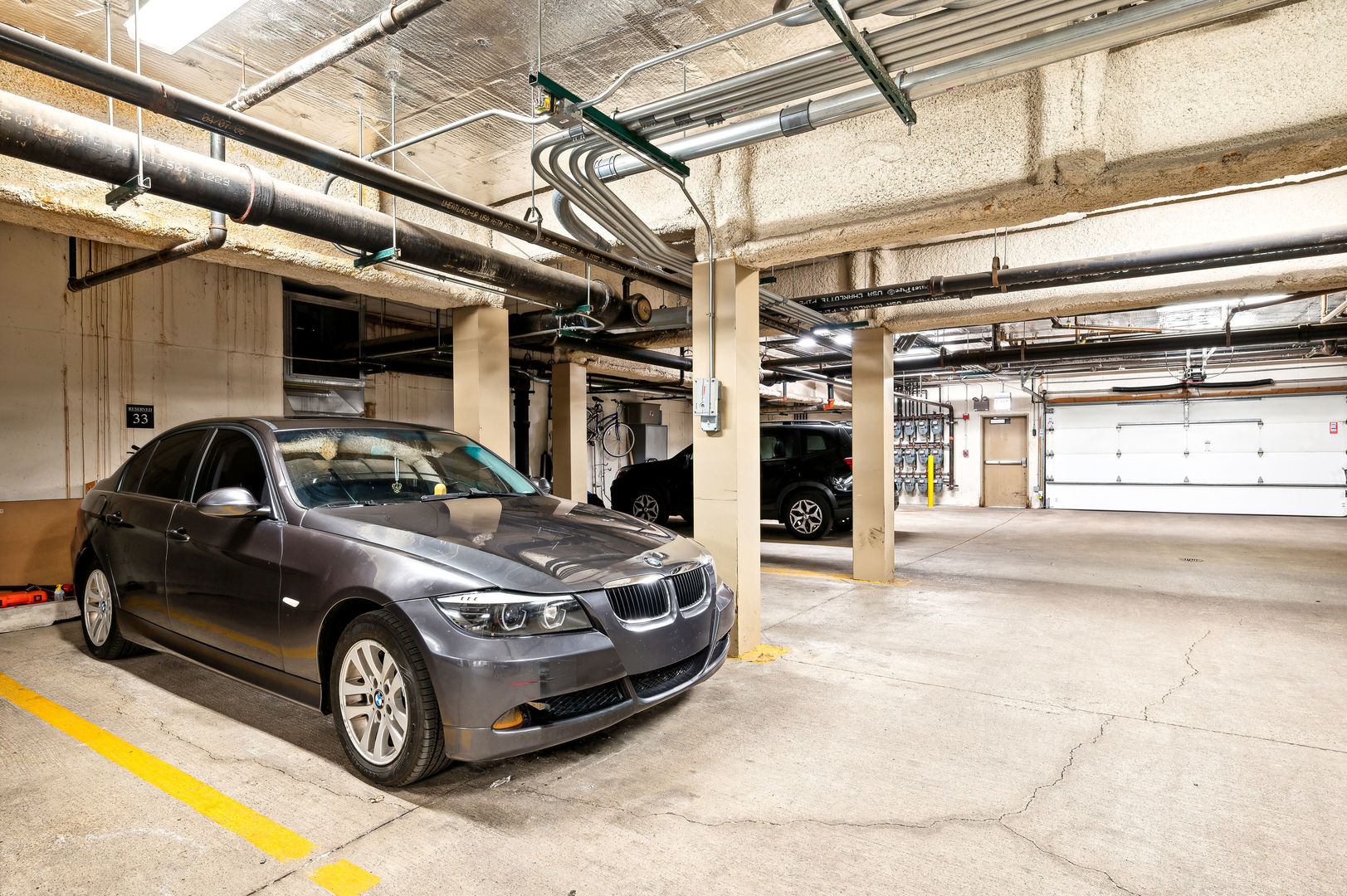 4311 North Sheridan Road, Unit 303 Chicago, IL 60613 - Photo 16 of 17 a car parked in garage
