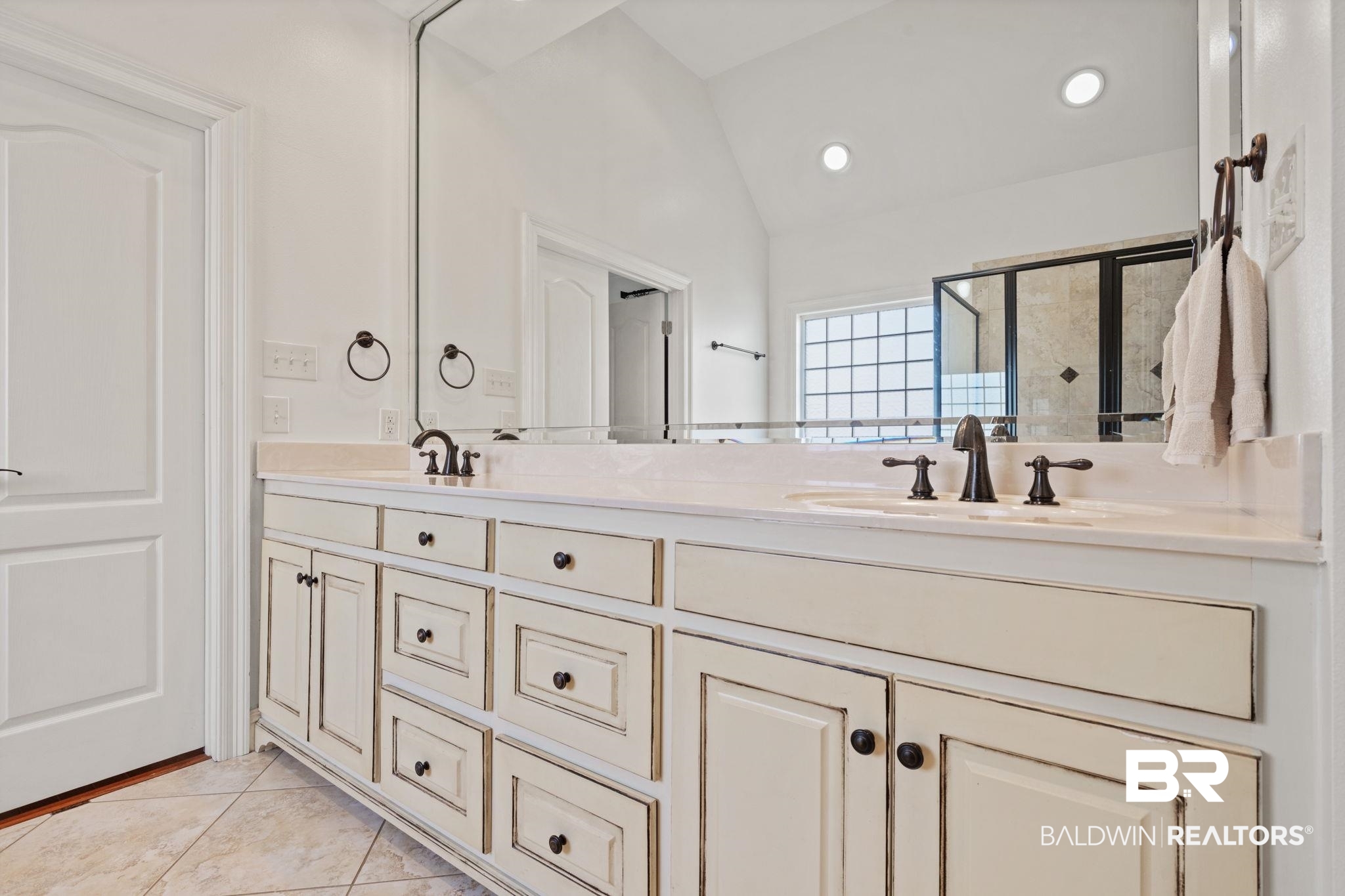 4771 Pecan Ridge East Mobile, AL 36619 - Photo 41 of 48 Full bath with lofted ceiling, double vanity, a stall shower, light tile patterned flooring, and recessed lighting