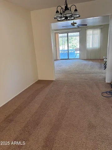 a utility room with cabinets washer and dryer