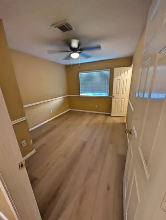a view of an empty room with a window