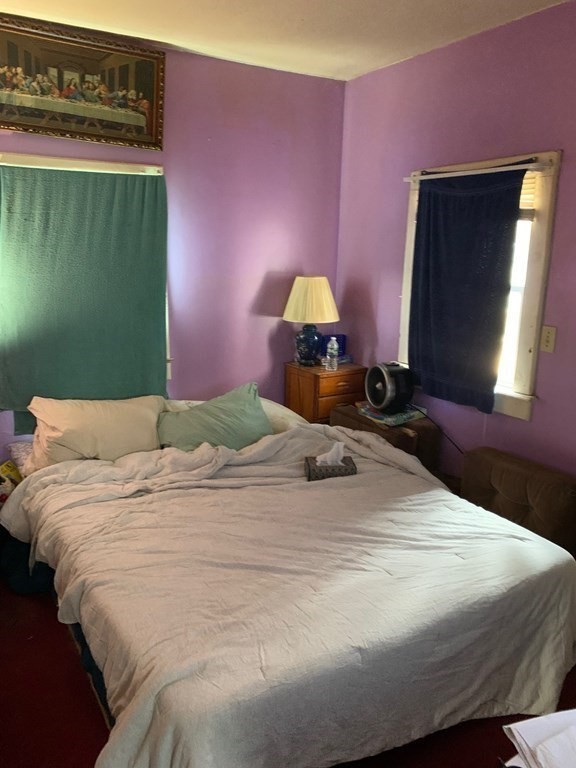 39 Evergreen Road Norton, MA 02766 - Photo 11 of 25 a bedroom with a bed and a fireplace