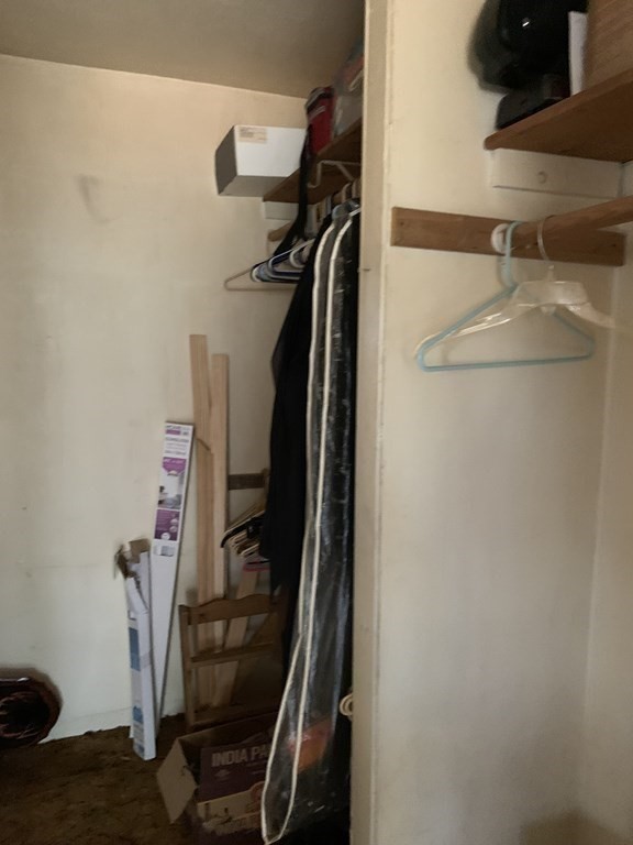 39 Evergreen Road Norton, MA 02766 - Photo 18 of 25 a view of walk in closet with clothes and shoes