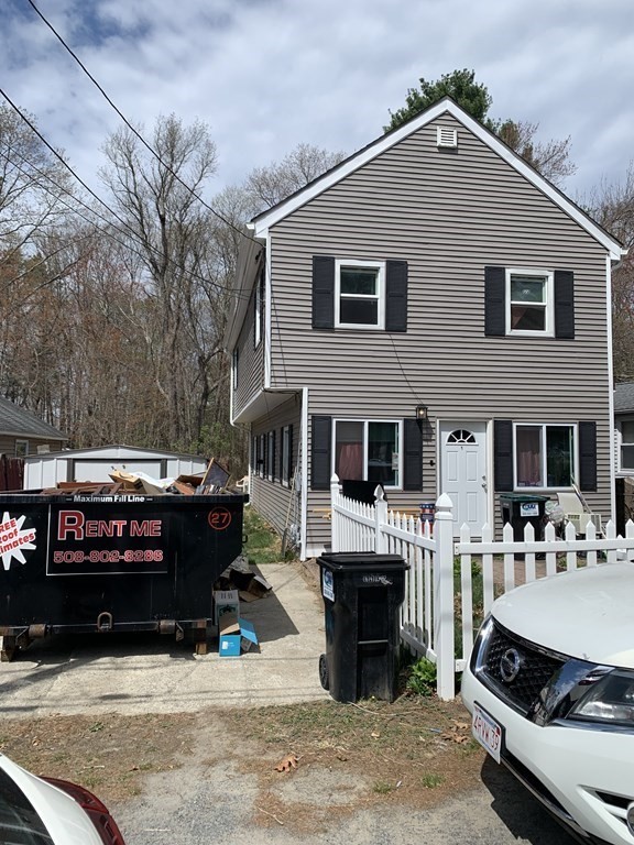 39 Evergreen Road Norton, MA 02766 - Photo 2 of 25 a view of a house with a barbeque next to a yard