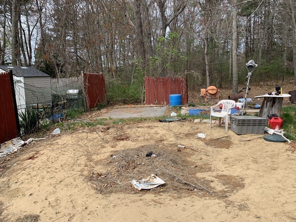 39 Evergreen Road Norton, MA 02766 - Photo 24 of 25 a backyard of a house with seating space