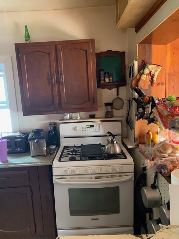 39 Evergreen Road Norton, MA 02766 - Photo 6 of 25 a stove top oven sitting inside of a kitchen
