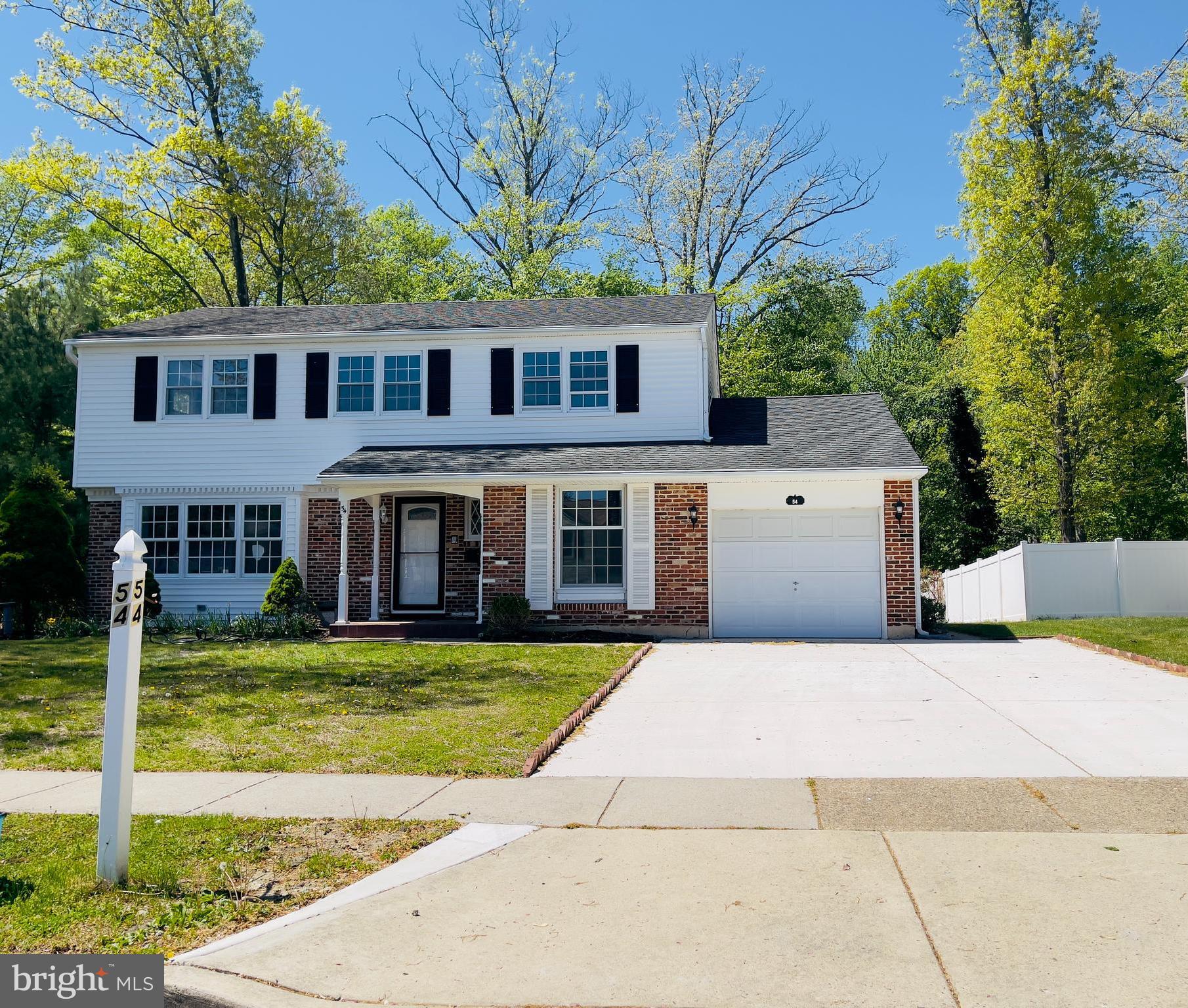 54 Saratoga Road Stratford, NJ 08084 - Photo 2 of 34 a front view of a house with a yard