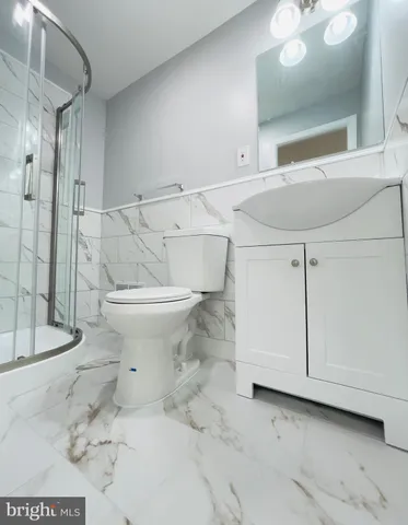a bathroom with a sink and toilet