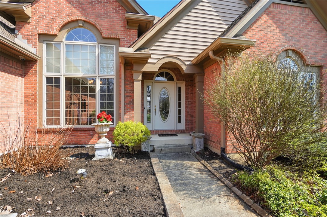 472 Timber Walk Court Springboro, OH 45066 - Photo 61 of 86 The home showcases a beautiful brick exterior with an inviting arched window and entryway.
