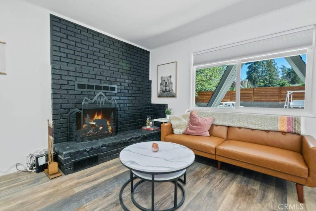 560 Edgemoor Road Big Bear Lake, CA 92315 - Photo 5 of 12 a living room with furniture and a fireplace