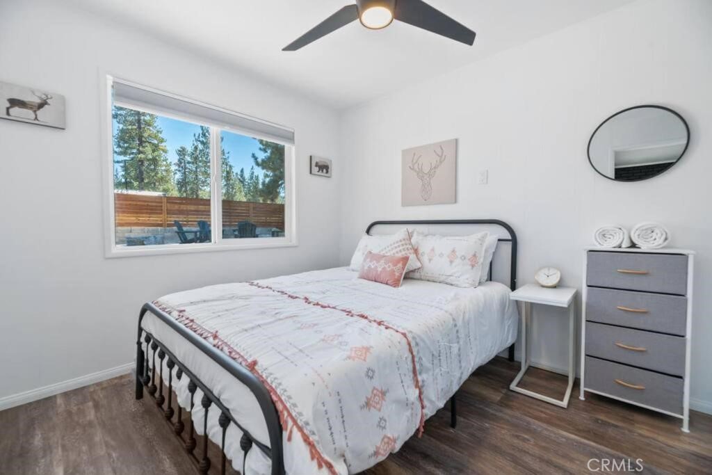 560 Edgemoor Road Big Bear Lake, CA 92315 - Photo 9 of 12 a bedroom with a bed and a window