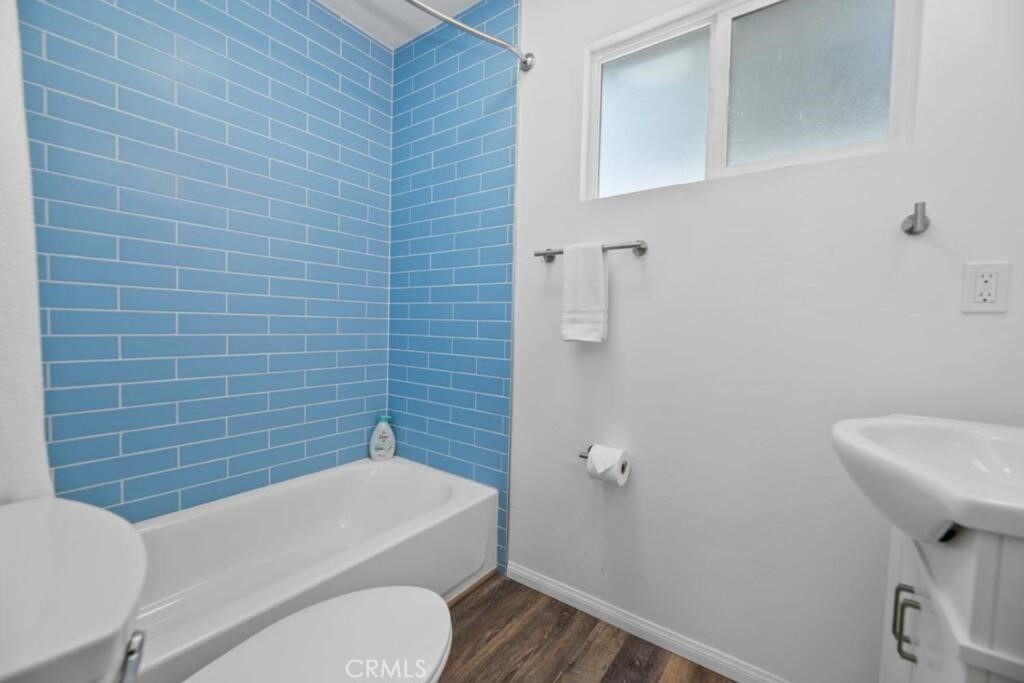 560 Edgemoor Road Big Bear Lake, CA 92315 - Photo 10 of 12 a bathroom with a toilet a sink and mirror