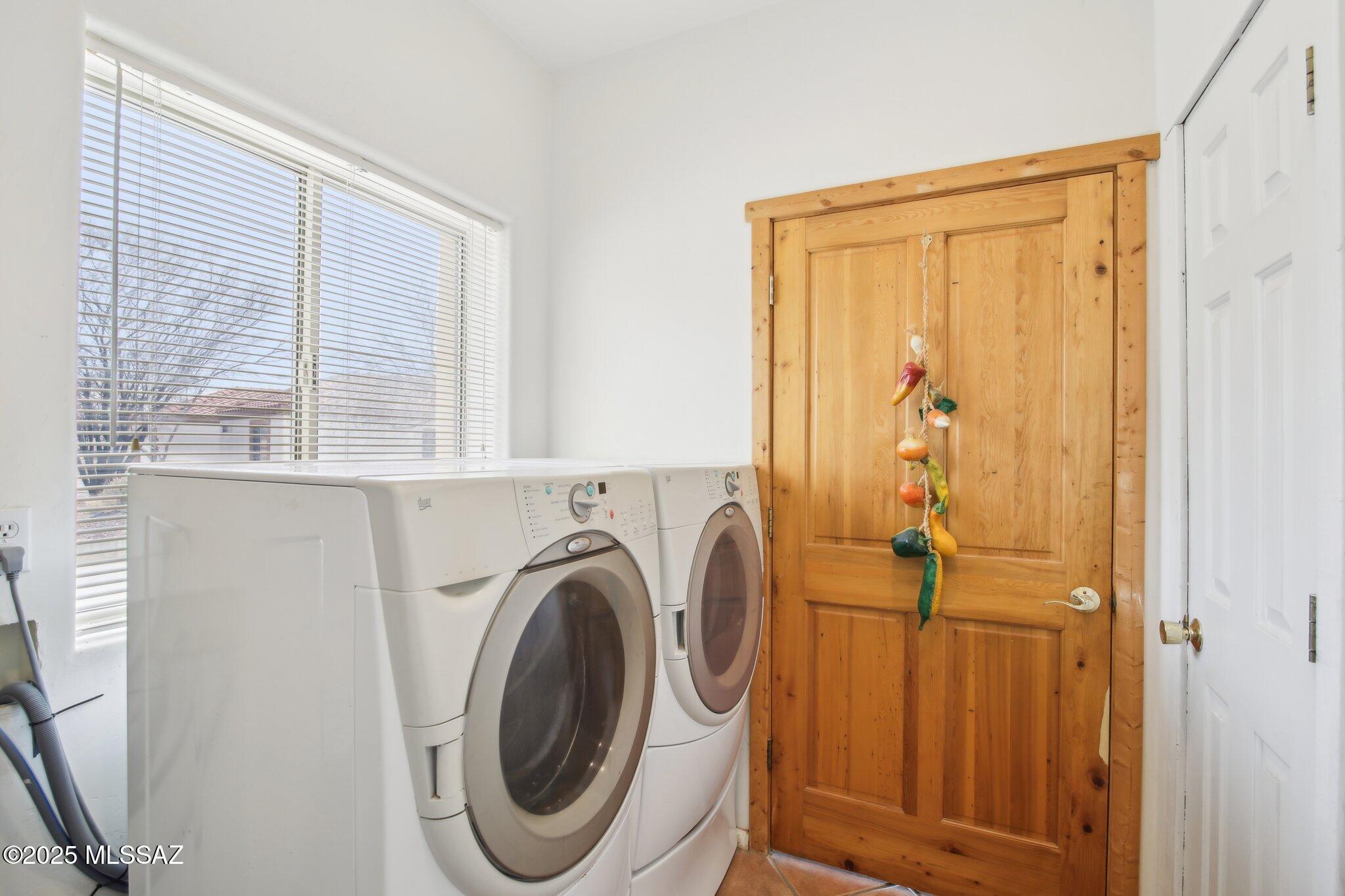 351 Camino Canoa Rio Rico, AZ 85648 - Photo 27 of 34 a utility room with dryer and washer