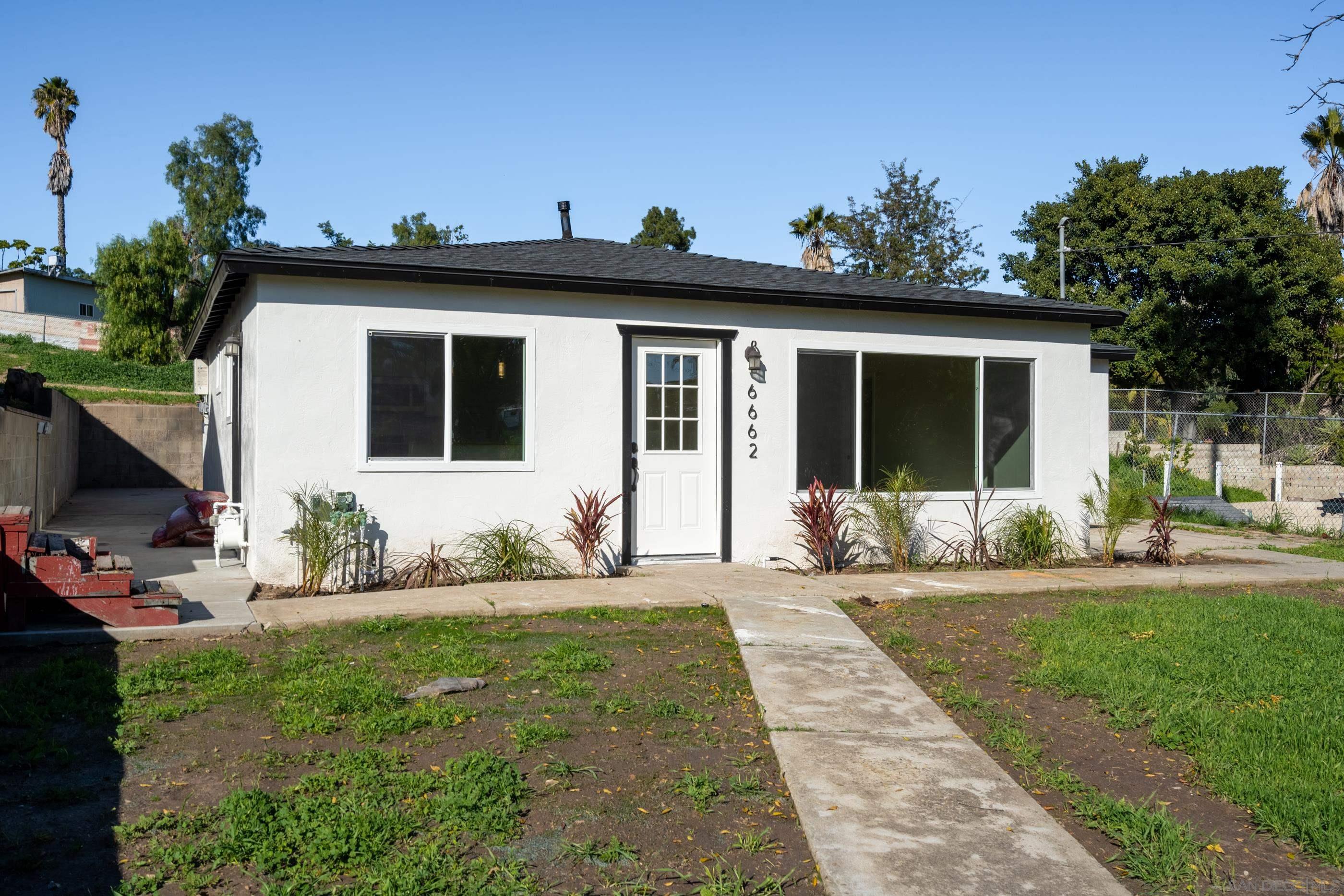 6662 Broadway San Diego, CA 92114 - Photo 1 of 20 a view of a house with yard and sitting area