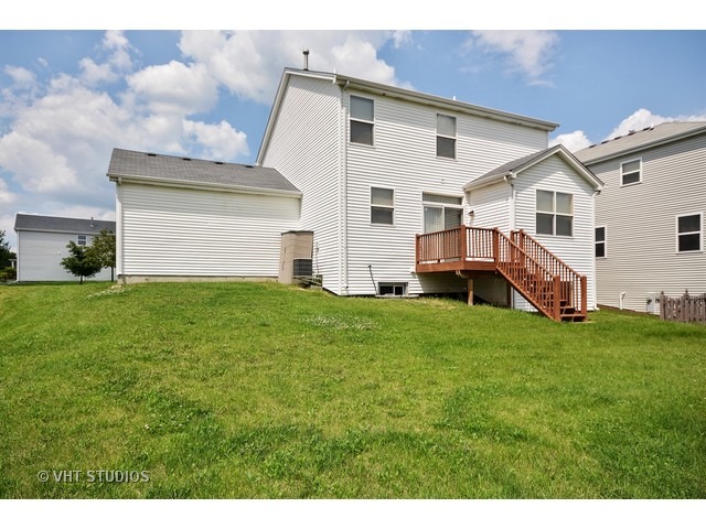 729 Periwinkle Lane Aurora, IL 60504 - Photo 2 of 15 a view of house with garden