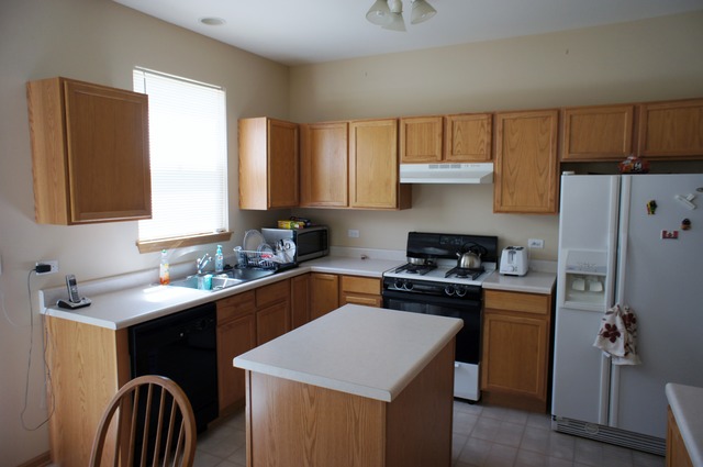 729 Periwinkle Lane Aurora, IL 60504 - Photo 3 of 15 a kitchen with a sink a stove and refrigerator
