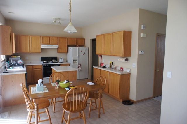 729 Periwinkle Lane Aurora, IL 60504 - Photo 4 of 15 a dining room with furniture a window and kitchen view