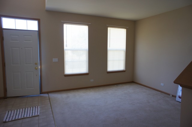 729 Periwinkle Lane Aurora, IL 60504 - Photo 7 of 15 an empty room with windows