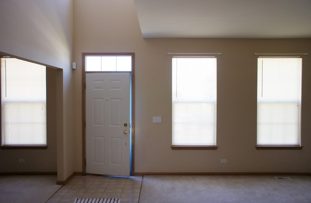729 Periwinkle Lane Aurora, IL 60504 - Photo 10 of 15 an empty room with windows