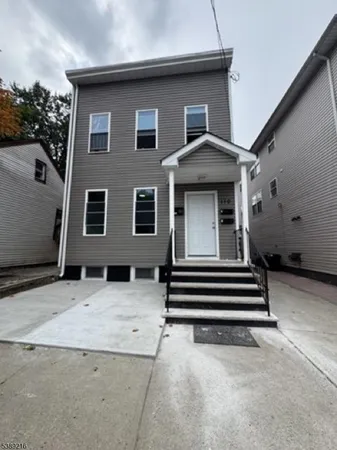 a house view with a backyard space
