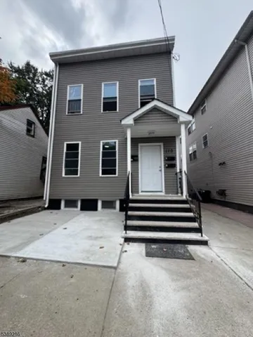 a house view with a backyard space