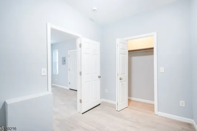 an empty room with mirror in it