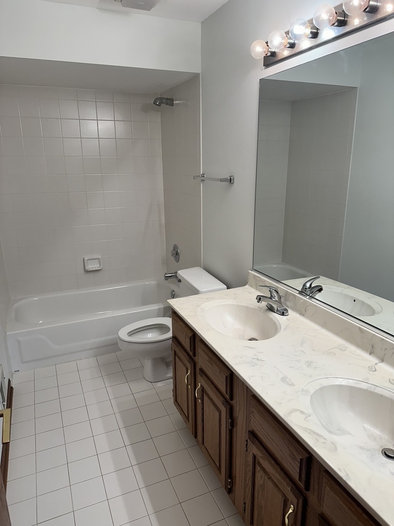 1592 Wakefield Court Mundelein, IL 60060 - Photo 16 of 25 a bathroom with a sink a toilet and shower