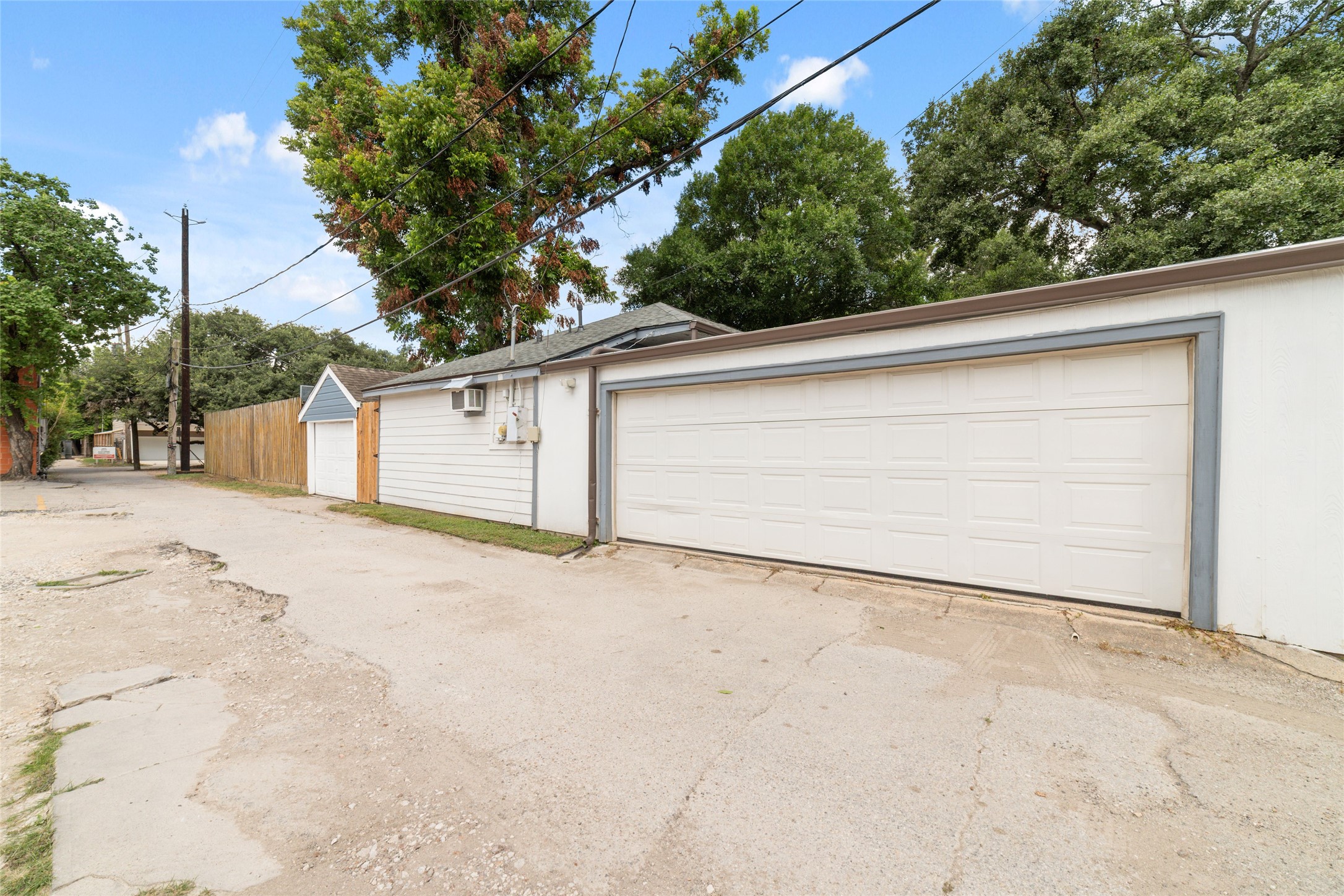 1613 California Street Houston, TX 77006 - Photo 37 of 50 The detached oversized two-car garage is accessed from the rear alley, preserving the home's charming streetscape while providing convenient off-street parking, rare oversized air conditioned workshop, and exceptional storage.