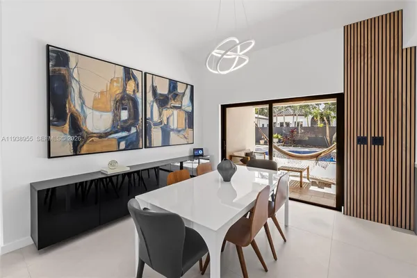 a dining room with furniture and window