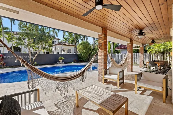 a view of a chairs and table in the patio