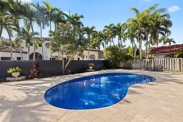 a view of a swimming pool with a patio