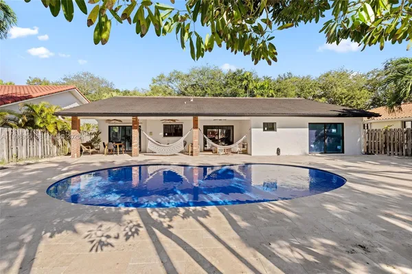 swimming pool view with a outdoor seating