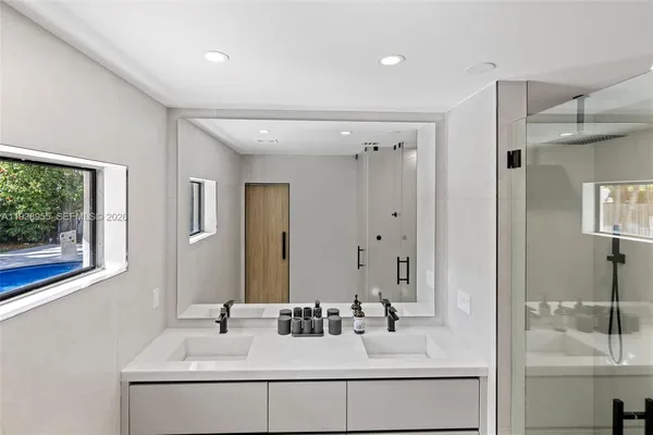 a bathroom with a sink and a mirror