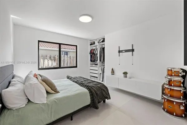 a bedroom with a bed and a closet