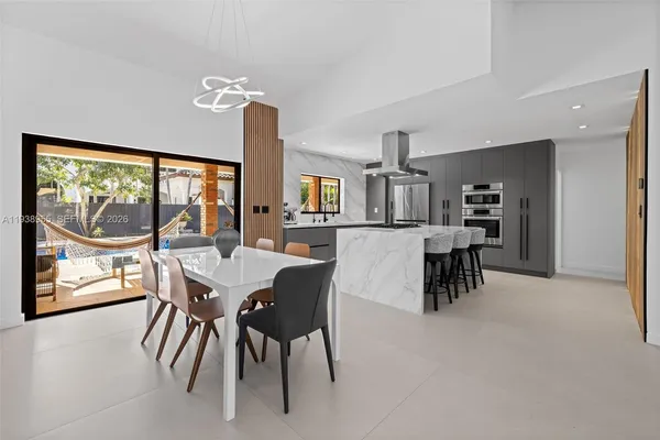 a view of a dining room with furniture window and outside view