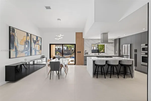 a view of a dining room with furniture window and outside view