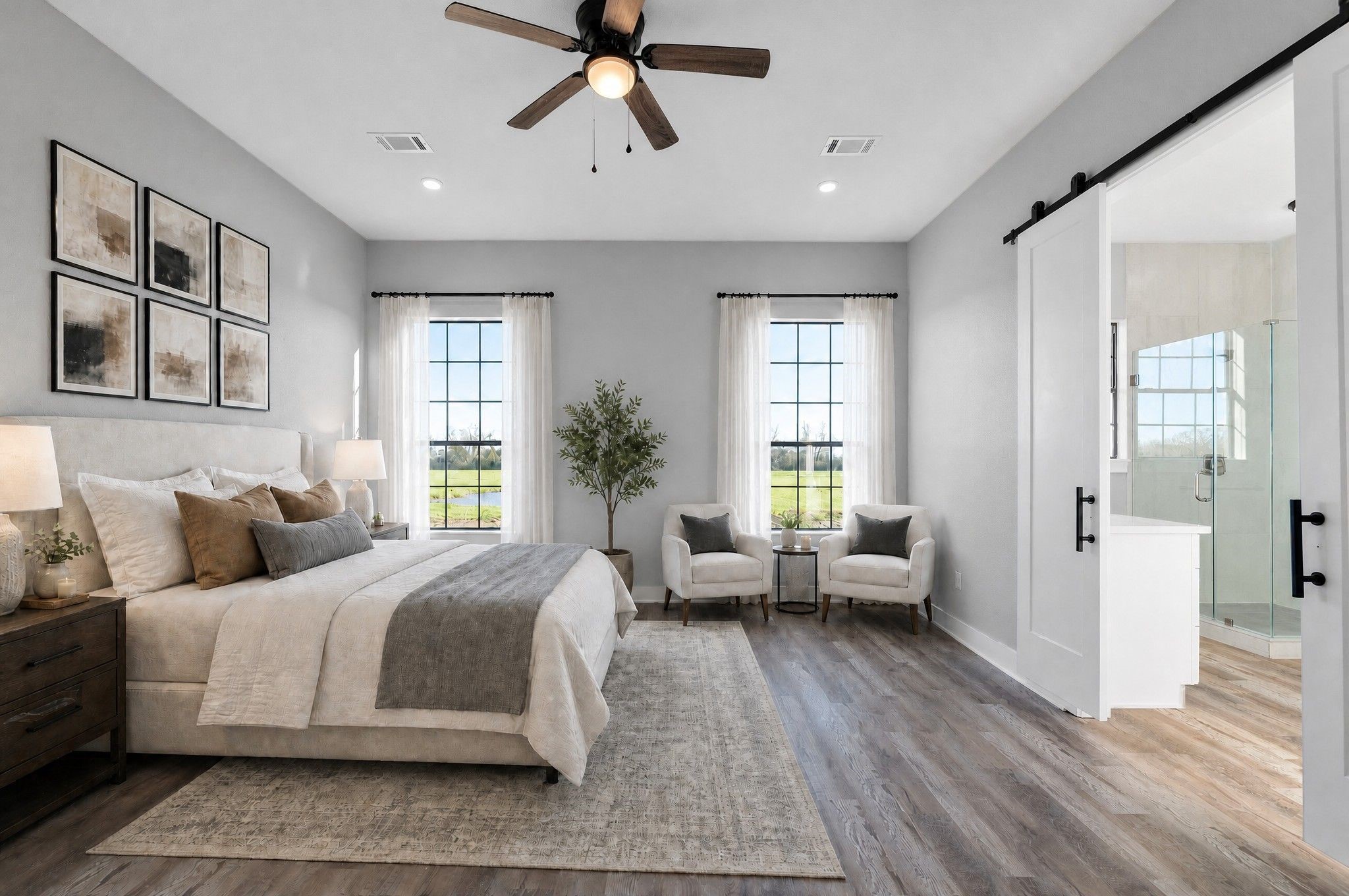 519 Chuckwagon Trail Angleton, TX 77515 - Photo 14 of 34 a spacious bedroom with a bed and wooden floor