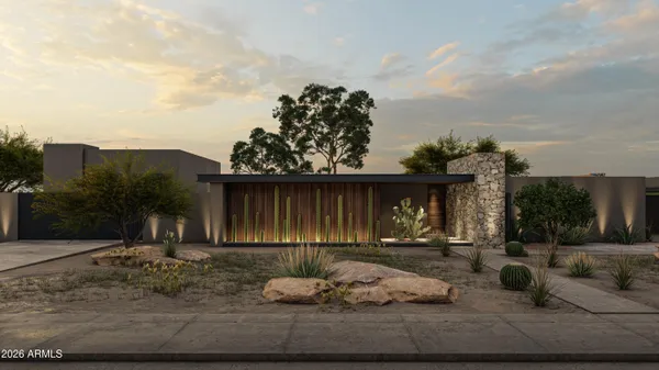 a backyard of a house with table and chairs