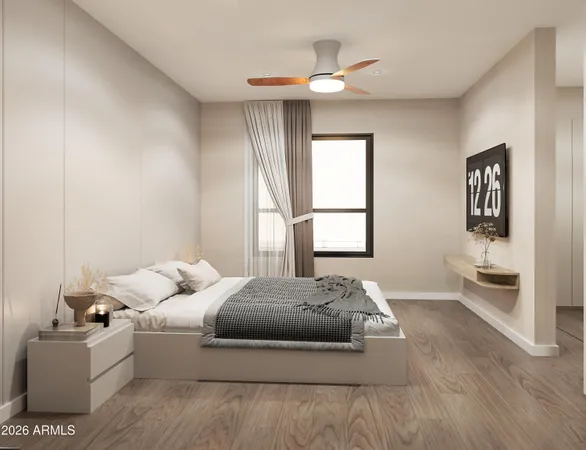 a bedroom with a bed and a window