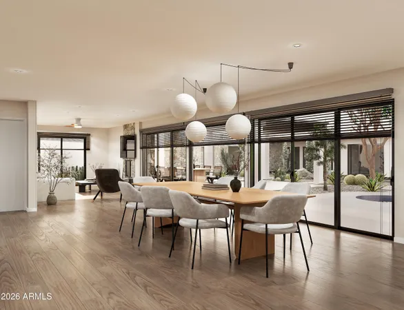 a view of a dining room with furniture window and wooden floor
