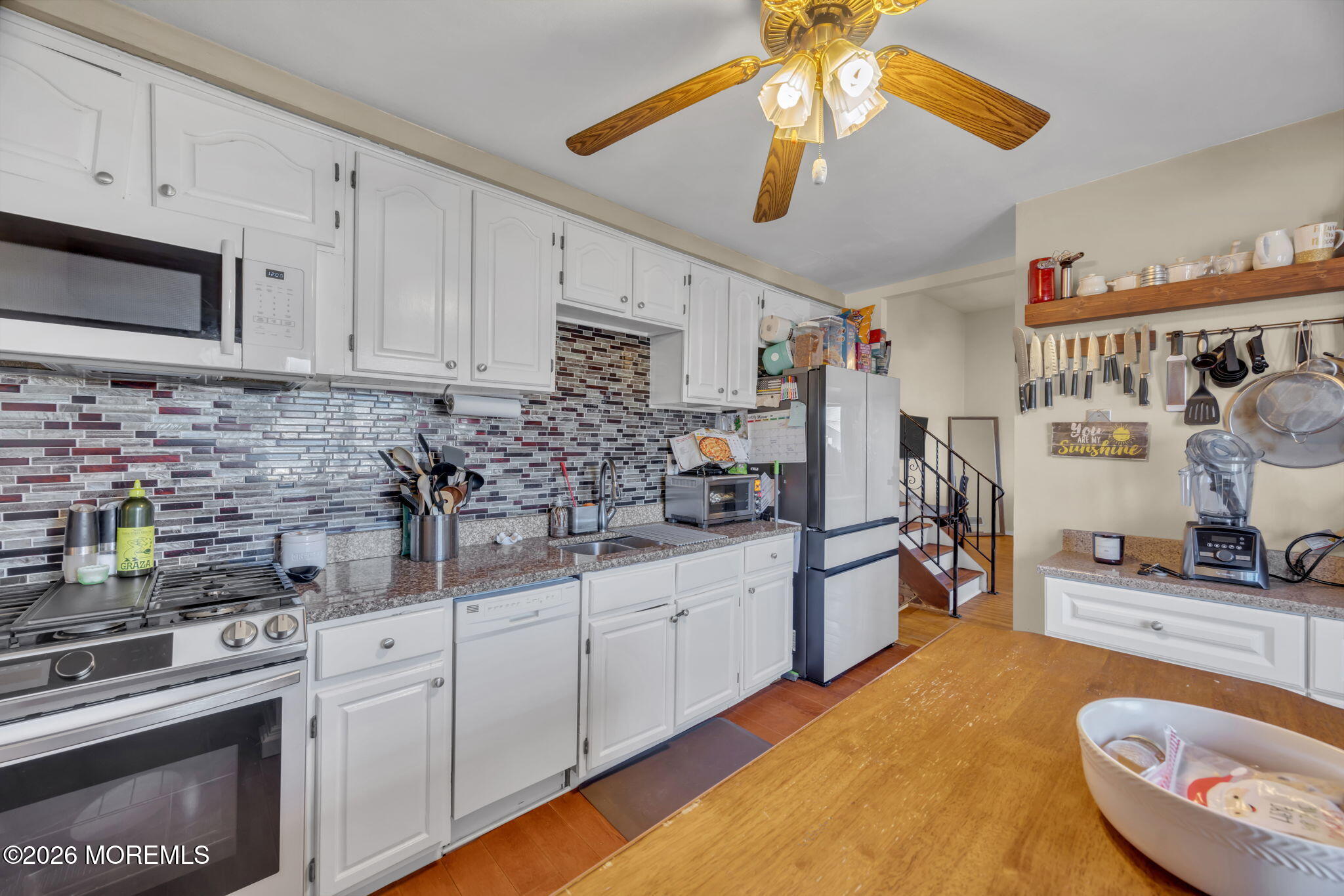68 Sunnybrae Boulevard Hamilton, NJ 08620 - Photo 13 of 35 a kitchen with stainless steel appliances granite countertop a sink a stove and cabinets