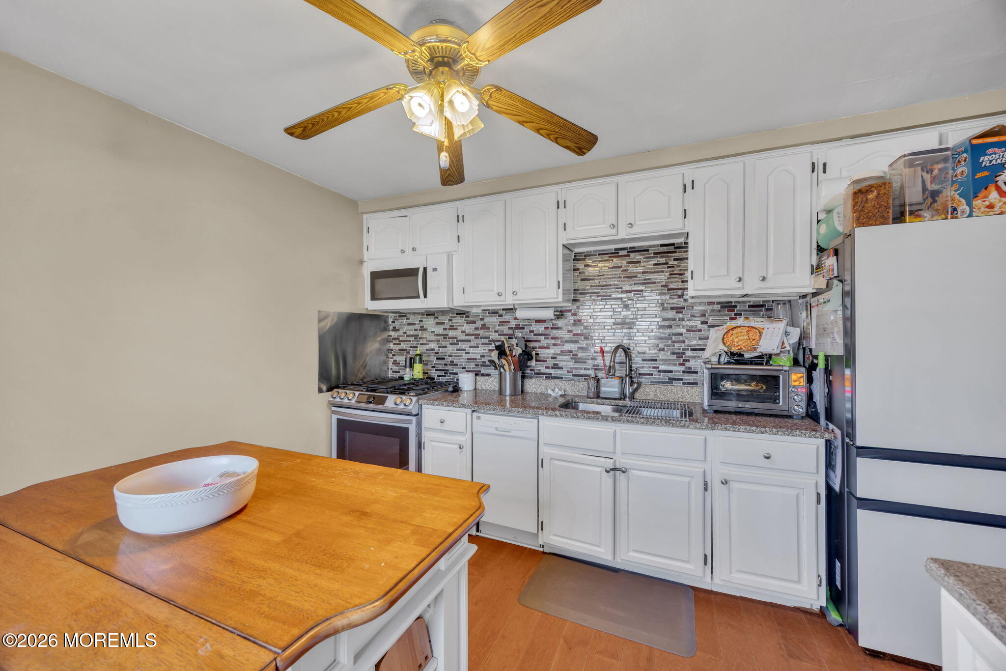 68 Sunnybrae Boulevard Hamilton, NJ 08620 - Photo 15 of 35 a kitchen with stainless steel appliances granite countertop a sink stove and refrigerator