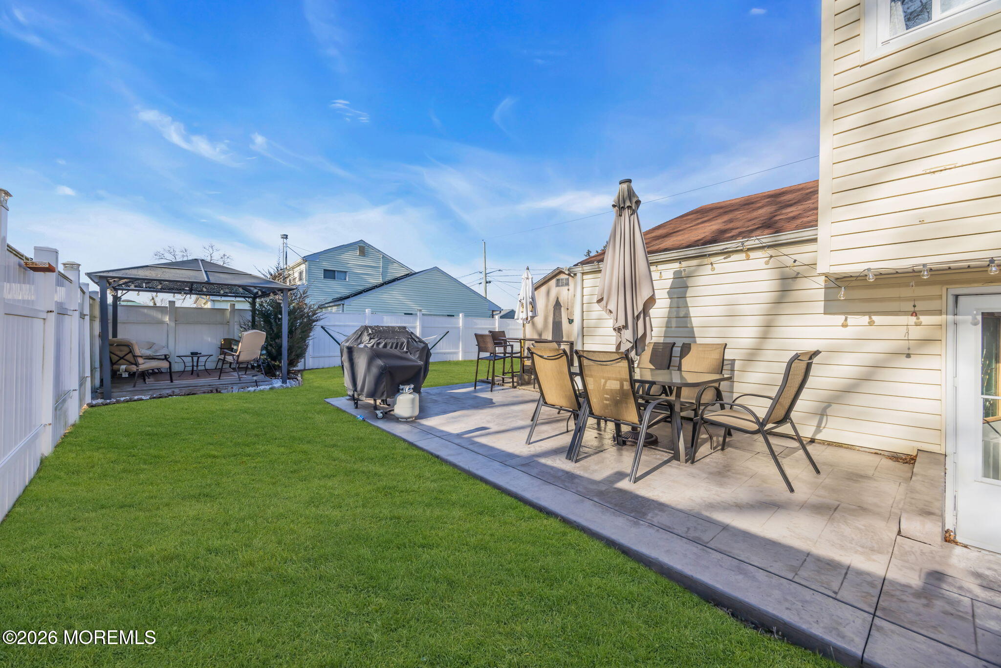 68 Sunnybrae Boulevard Hamilton, NJ 08620 - Photo 31 of 35 a view of a backyard with table and chairs