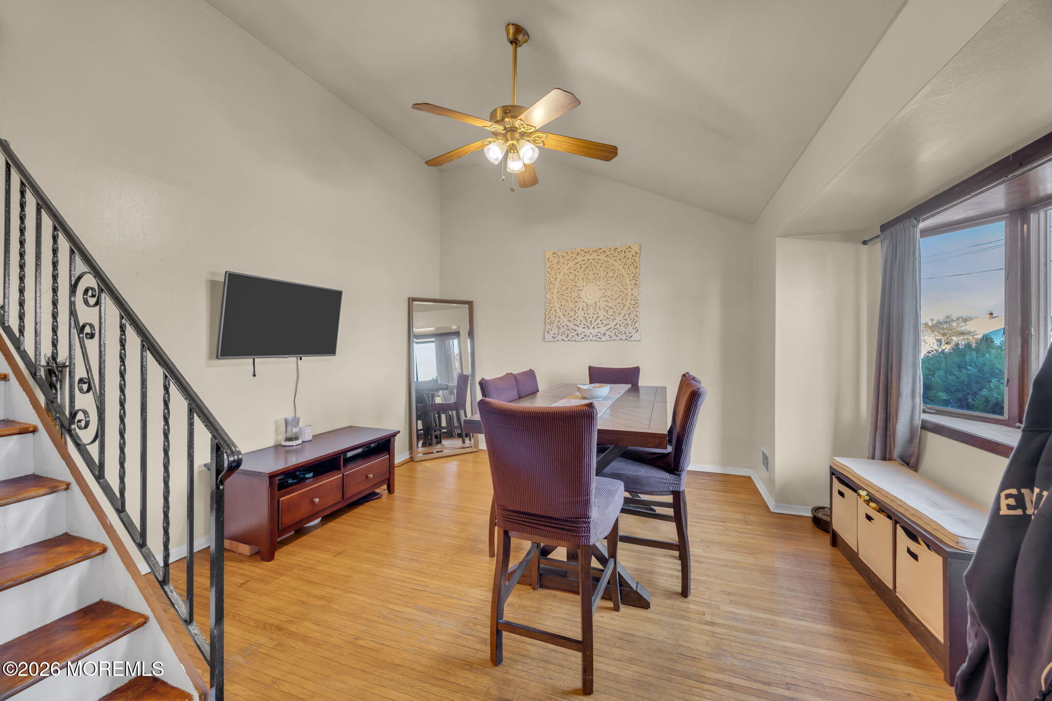 68 Sunnybrae Boulevard Hamilton, NJ 08620 - Photo 9 of 35 a view of a livingroom with furniture a flat screen tv a chandelier fan and wooden floor