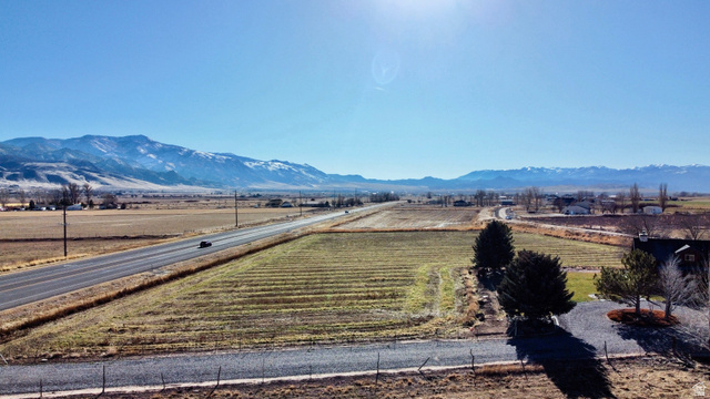 76 Highway 118 Monroe, UT 84754 - Photo 13 of 76 View of mountain backdrop featuring rows of crops and rural landscape